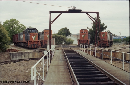 120-31
Wodonga loco depot turntable, pit and deck, looking across deck at radial roads sees V/Line broad gauge locos from left, T class T 402 Clyde Engineering EMD model G18B serial 67-497, X class X 36 Clyde Engineering EMD model G16C serial 66-489, X class X 54 Clyde Engineering EMD model G26C serial 75-801, Y class Y 143 Clyde Engineering EMD model G6B serial 65-409.
Keywords: T-class;T402;Clyde-Engineering-Granville-NSW;EMD;G18B;67-497;