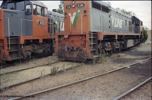 120-35
Wodonga loco depot, V/Line broad gauge loco X class X 36 Clyde Engineering EMD model G16C serial 66-489, showing pilot detail, T class T 402 cab side.
Keywords: X-class;X36;Clyde-Engineering-Granville-NSW;EMD;G16C;66-489;