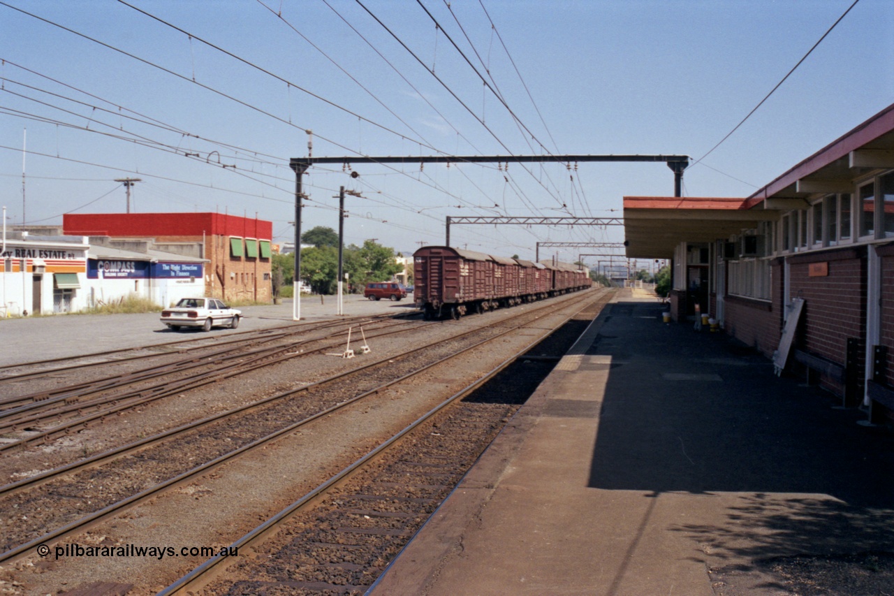 121-31
Morwell station yard overview and station building and platform, looking towards Melbourne, bogie louvre vans on No. 3 Road.
