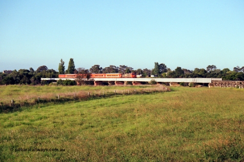 123-1-14
Avon River steel bridge, trestle bridge over flood plain at right, V/Line broad gauge N class N 451 'City of Portland' Clyde Engineering EMD model JT22HC-2 serial 85-1219 N set, up Bairnsdale pass, distant shot.
Keywords: N-class;N451;Clyde-Engineering-Somerton-Victoria;EMD;JT22HC-2;85-1219;