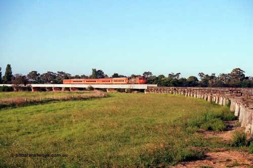 123-1-15
Avon River steel bridge, trestle bridge over flood plain at right, V/Line broad gauge N class N 451 'City of Portland' Clyde Engineering EMD model JT22HC-2 serial 85-1219 N set, up Bairnsdale pass, distant shot.
Keywords: N-class;N451;Clyde-Engineering-Somerton-Victoria;EMD;JT22HC-2;85-1219;