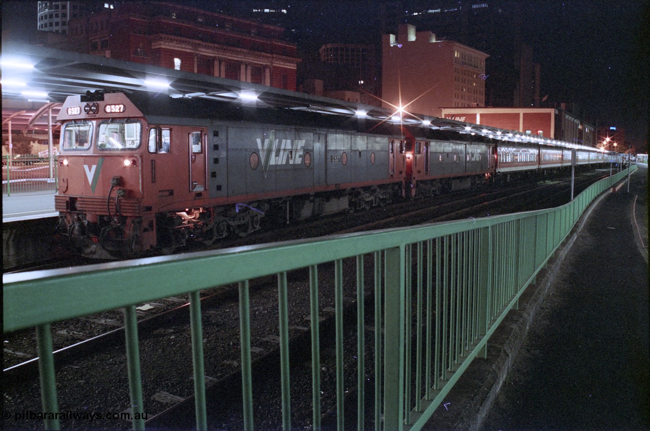 123-2-29
Spencer Street Station Platform 1 Sydney Express, V/Line standard gauge G classes G 527 Clyde Engineering EMD model JT26C-2SS serial 88-1257 and sister provide the head-end power, night shot.
Keywords: G-class;G527;Clyde-Engineering-Somerton-Victoria;EMD;JT26C-2SS;88-1257;