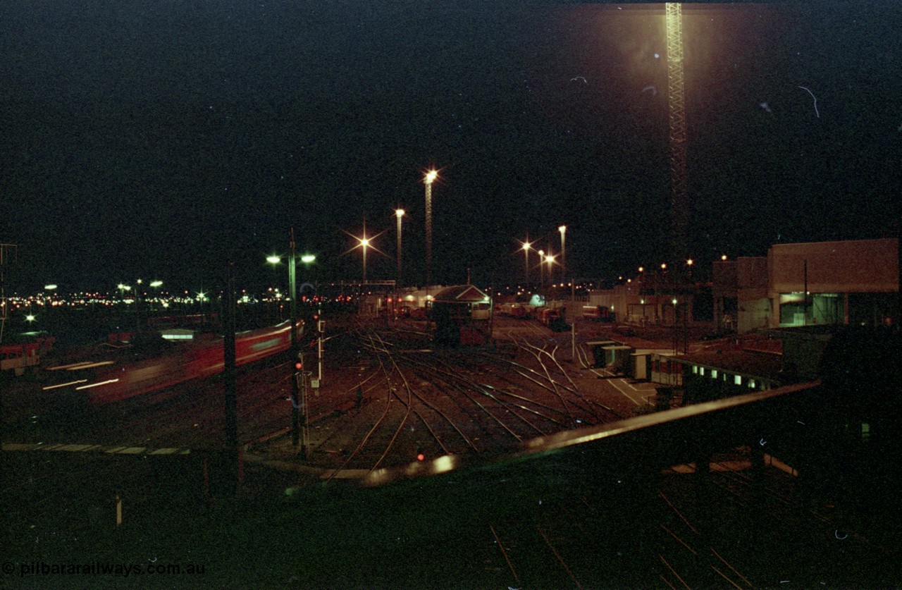 123-2-31
Spencer Street Station yard view, night shot, signal box no. 1, train moving past.

