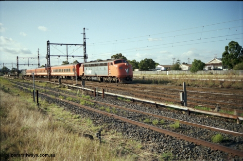 124-04
Sunshine V/Line broad gauge B class B 76 Clyde Engineering EMD model ML2 serial ML2-17 with an up passenger train of N set and PH power van at the 8 km post.
Keywords: B-class;B76;Clyde-Engineering-Granville-NSW;EMD;ML2;ML2-17;bulldog;