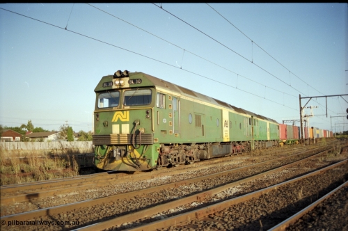 124-20
Sunshine broad gauge Australian National BL classes Clyde Engineering EMD model JT26C-2SS serial 83-1014 and BL 35 Clyde Engineering EMD model JT26C-2SS serial 83-1019 with a down Adelaide bound goods train head off the Independent Through Goods line and cross over the passenger lines heading for the main western line.
Keywords: BL-class;BL30;Clyde-Engineering-Rosewater-SA;EMD;JT26C-2SS;83-1014;
