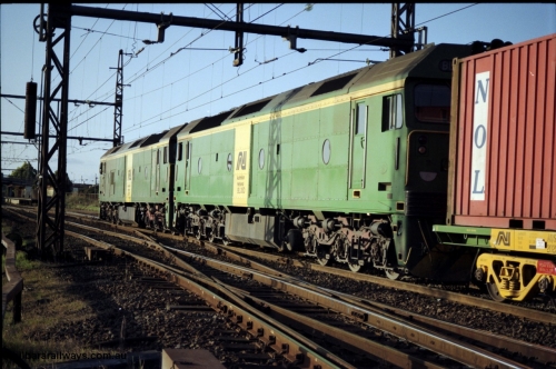 124-21
Sunshine broad gauge Australian National BL classes Clyde Engineering EMD model JT26C-2SS serial 83-1014 and Clyde Engineering EMD model JT26C-2SS serial 83-1019 with a down Adelaide bound goods train from the Independent Through Goods line to the passenger lines heading for the main western line, trailing view.
Keywords: BL-class;BL35;Clyde-Engineering-Rosewater-SA;EMD;JT26C-2SS;83-1019;
