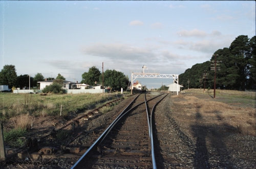 125-02
Ballan station overview, looking toward Melbourne from up end points, signal gantry, road set for down pass.
