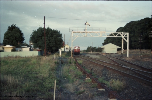 125-04
Ballan station overview, signal gantry, goods shed, V/Line broad gauge N class Clyde Engineering EMD model JT22HC-2 serial 87-1203 'City of Traralgon' with down pass.
Keywords: N-class;N474;Clyde-Engineering-Somerton-Victoria;EMD;JT22HC-2;87-1203;