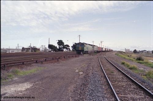 126-02
Tottenham yard, broad gauge Australian National BL class BL 29 Clyde Engineering EMD model JT26C-2SS serial 83-1013 brings up Adelaide goods train 9150 into Tottenham yard past semaphore signal post 4, taken from standard gauge line, looking towards Sunshine.
Keywords: BL-class;BL29;Clyde-Engineering-Rosewater-SA;EMD;JT26C-2SS;83-1013;