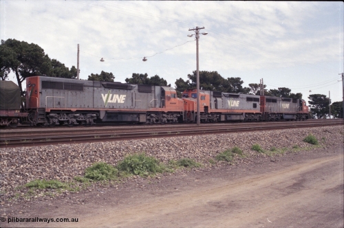 126-07
Tottenham broad gauge train 9169 down goods to Adelaide via Cressy, brake testing at Tottenham 9.5 km, V/Line C classes C 503 Clyde Engineering EMD model GT26C serial 76-826, C 506 serial 76-829 and C 501 'George Brown' serial 76-824, trailing view.
Keywords: C-class;C501;Clyde-Engineering-Rosewater-SA;EMD;GT26C;76-824;C506;76-826;C503;76-829;