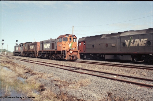 126-26
Wallan Loop, standard gauge V/Line G class G 518 Clyde Engineering EMD model JT26C-2SS serial 85-1231, up Melbourne Express passenger train, crossing rescue locos in loop at Wallan, V/Line Clyde Engineering EMD G8B model Y classes Y 151 serial 67-571 and Y 102 serial 63-292 and G18B T class T 411 serial 68-627.
Keywords: G-class;G518;Clyde-Engineering-Rosewater-SA;EMD;JT26C-2SS;85-1231;