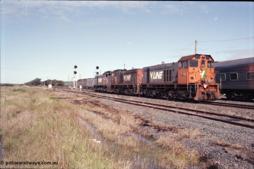 126-27
Wallan Loop, standard gauge V/Line G class G 518 Clyde Engineering EMD model JT26C-2SS serial 85-1231 runs the Up Melbourne Express passenger train, crossing relief light locos in loop at Wallan, V/Line Clyde Engineering EMD G8B model Y classes Y 151 serial 67-571 and Y 102 serial 63-292 and G18B T class T 411 serial 68-627.
Keywords: Y-class;Y151;Clyde-Engineering-Granville-NSW;EMD;G6B;67-571;