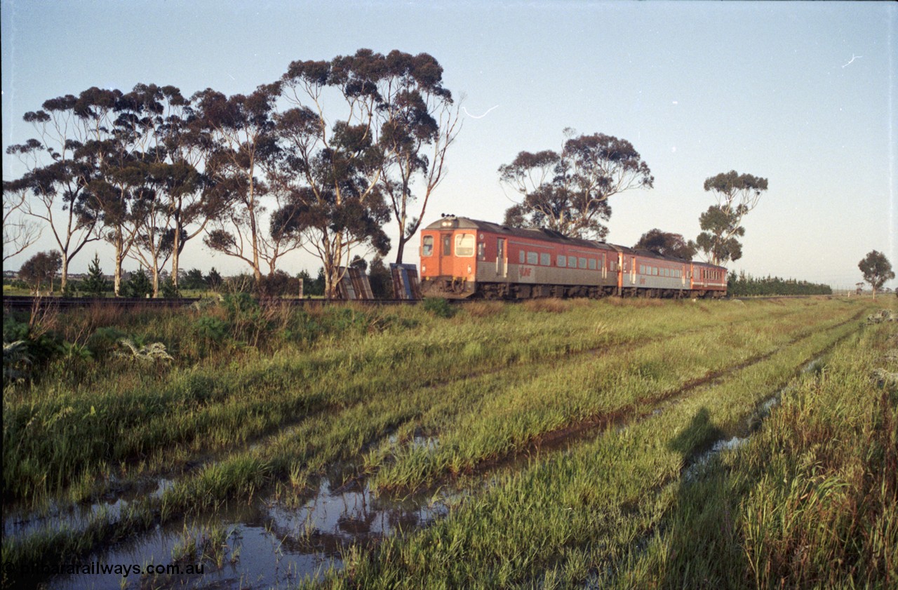 127-18
Deer Park West, early Saturday morning sees twin broad gauge Tulloch Ltd V/Line DRC class rail motors and an MTH trailer heading for Melbourne with an up Bacchus Marsh passenger service.
Keywords: DRC-class;Tulloch-Ltd-NSW;