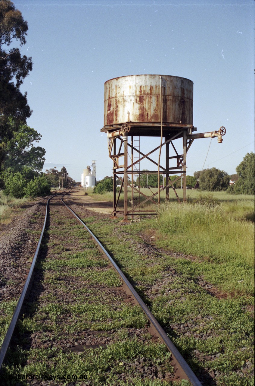 127-35
Elmore water tank, mainline looking south towards Elmore station yard, 207 km post, the right hand side out loading pipe was for the Cohuna line.

