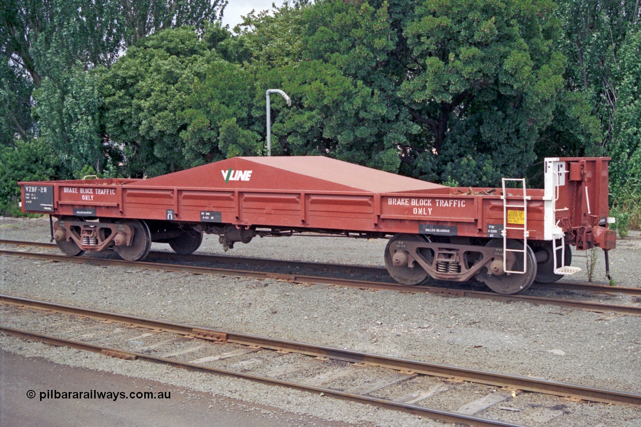 128-00
Ballarat yard, broad gauge V/Line VZBF type bogie brake block transport waggon VZBF 2, a 1990 conversion from what was originally an Victorian Railways BP type steel mail van BP 77 built in 1959 at Newport Workshops as part of a batch of eighty three. It went on to be recoded to BB 222 in December 1960, then BMF 2 in December 1961, BMX 2 in February 1968, recoded to VBAX in 1979, then in 1990 converted to the VZBF along with two other waggons as a group of three.
Keywords: VZBF-type;VZBF2;Victorian-Railways-Newport-WS;BP-type;BP77;BB-type;BB222;BMF-type;BMF2;BMX-type;BMX2;VBAX-type;VBAX2;