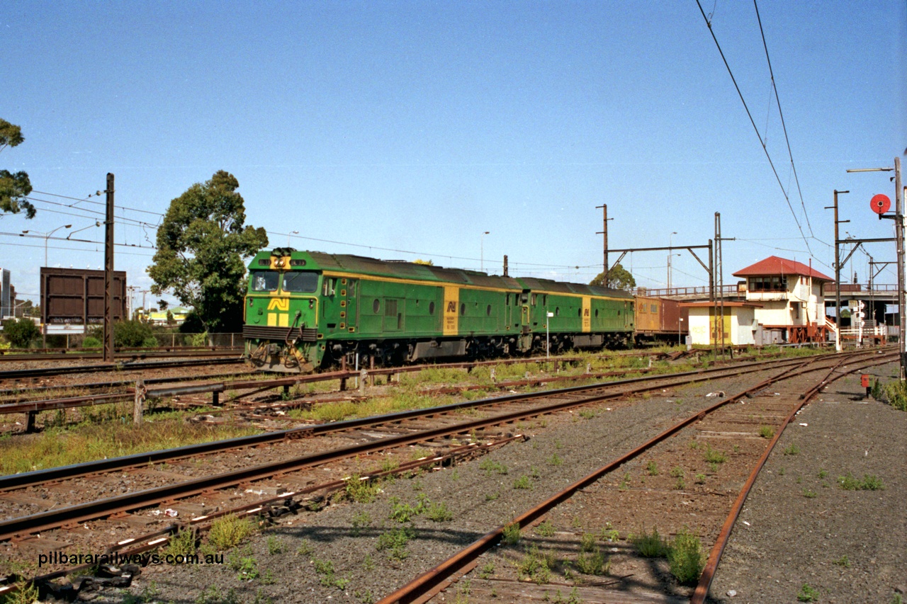 129-1-08
Sunshine, Australian National BL classes BL 33 Clyde Engineering EMD model JT26C-2SS serial 83-1017 and BL 32 serial 83-1016 in AN livery, lead a broad gauge down Adelaide goods train along No.2 Rd onto the South Line, signal box, points and point rodding, Sunshine still mechanically interlocked.
Keywords: BL-class;BL33;Clyde-Engineering-Rosewater-SA;EMD;JT26C-2SS;83-1017;