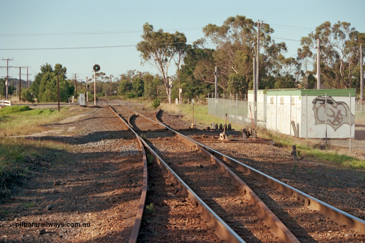 129-1-18
Baxter track view, ex Mornington junction, looking towards Somerville, points and point and signal levers with interlocking, searchlight signal post.
