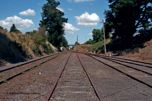 129-2-23
Leongatha yard view looking down direction from near the end of the platform. Ogilvy or Bair St bridge in the distance.

