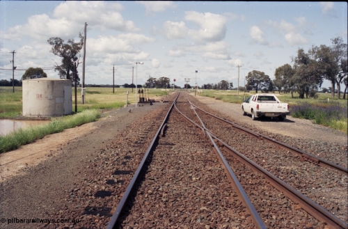 131-1-12
Barnes, track view, looking south from junction points, searchlight and semaphore signals, signal and point levers, standing on the Deniliquin line, Balranald line at right.
