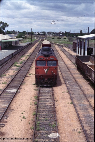 132-05
Ouyen station overview, broad gauge V/Line G class G 540 Clyde Engineering EMD model JT26C-2SS serial 89-1273 with stabled up gypsum train 9138, looking south from footbridge, station building and platform, Freightgate canopy.
Keywords: G-class;G540;Clyde-Engineering-Somerton-Victoria;EMD;JT26C-2SS;89-1273;