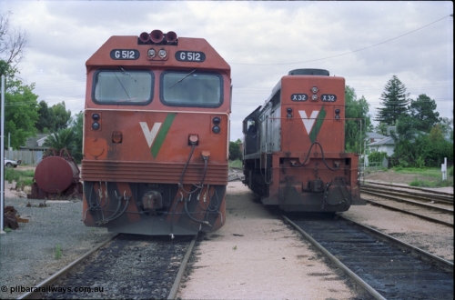 132-24
Mildura loco depot V/Line broad gauge X class X 32 Clyde Engineering EMD model G16C serial 66-485 and G class G 512 Clyde Engineering EMD model JT26C-2SS serial 84-1240, front view.
Keywords: G-class;G512;Clyde-Engineering-Rosewater-SA;EMD;JT26C-2SS;84-1240;X-class;X32;G16C;66-485;