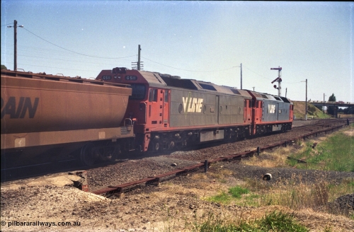 133-19
Gheringhap, V/Line broad gauge grain train 9121 departing for the Ballarat line, point rodding, semaphore signal post 4 pulled off for move, G class locos G 529 Clyde Engineering EMD model JT26C-2SS serial 88-1259 and G 511 serial 84-1239, trailing view.
Keywords: G-class;G511;Clyde-Engineering-Rosewater-SA;EMD;JT26C-2SS;84-1239;