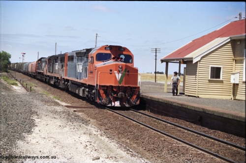 133-21
Gheringhap, V/Line broad gauge locos C class leader C 501 'George Brown' Clyde Engineering EMD model GT26C serial 76-824 leads C 506 serial 76-829 and X class X 45 'Edgar H Brownbill' Clyde Engineering EMD model G26C serial 75-792 with 9169 down Adelaide goods train, pausing to swap the electric staff for a train order.
Keywords: C-class;C501;Clyde-Engineering-Rosewater-SA;EMD;GT26C;76-824;