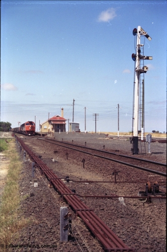 133-26
Gheringhap, V/Line broad gauge locos C class leader C 501 'George Brown' Clyde Engineering EMD model GT26C serial 76-824 leads C 506 serial 76-829 and X class X 45 'Edgar H Brownbill' Clyde Engineering EMD model G26C serial 75-792 with train 9169 down Adelaide goods, pausing to swap the electric staff with a train order, station overview, point rodding and signal wires, semaphore signal post 4 pulled off for the Cressy line, interlocking.
Keywords: C-class;C501;Clyde-Engineering-Rosewater-SA;EMD;GT26C;76-824;