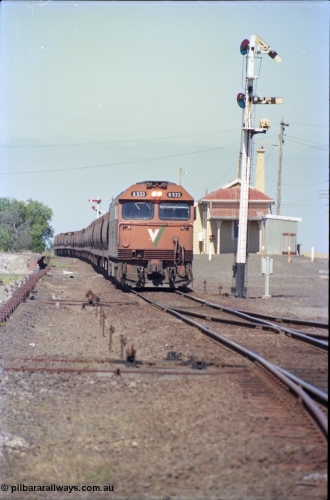 133-33
Gheringhap station yard overview, looking from Ballarat line points, semaphore signal post 4 pulled off for Cressy line, points, point rodding, signal wires and interlocking, V/Line broad gauge down empty grain train 9123 behind G class loco G 533 Clyde Engineering EMD model JT26C-2SS serial 88-1263.
Keywords: G-class;G533;Clyde-Engineering-Somerton-Victoria;EMD;JT26C-2SS;88-1263;