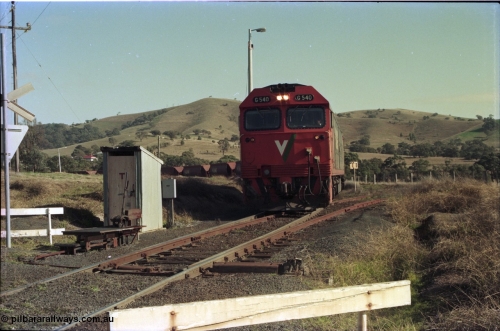 135-14
Kilmore East Apex Quarry siding, V/Line broad gauge G class G 540 Clyde Engineering EMD model JT26C-2SS serial 89-1273 empty train 9315 climbing into siding, points, telephone cabin, point lever.
Keywords: G-class;G540;Clyde-Engineering-Somerton-Victoria;EMD;JT26C-2SS;89-1273;