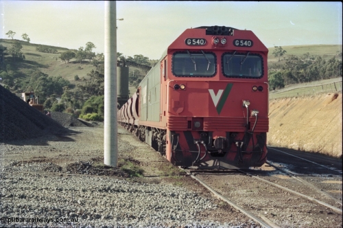 135-19
Kilmore East Apex Quarry siding, V/Line broad gauge G class G 540 Clyde Engineering EMD model JT26C-2SS serial 89-1273 on the front of the stone train as it is loaded by the front-end wheel loader.
Keywords: G-class;G540;Clyde-Engineering-Somerton-Victoria;EMD;JT26C-2SS;89-1273;