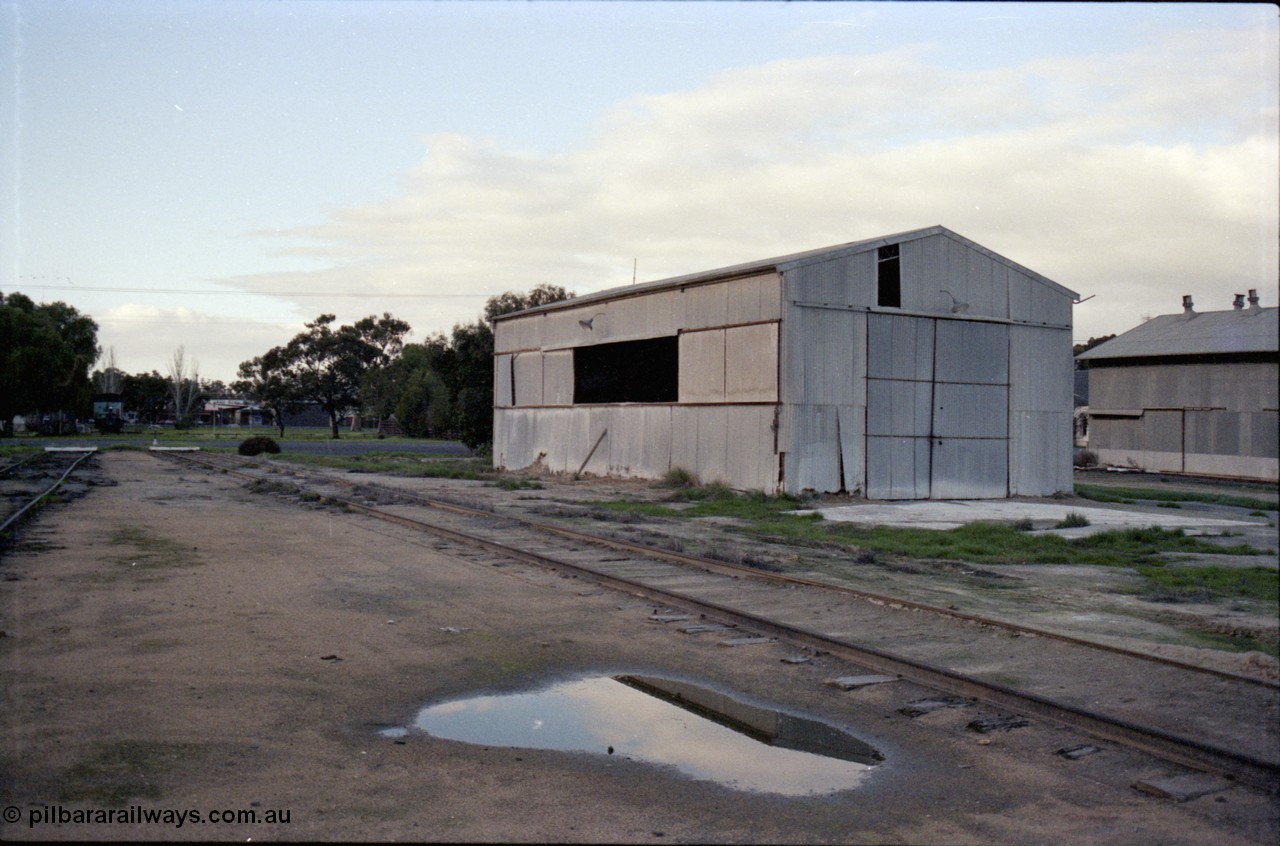 136-14
Deniliquin yard view, north end, note baulks on tracks, turntable across road in background, super phosphate shed.
