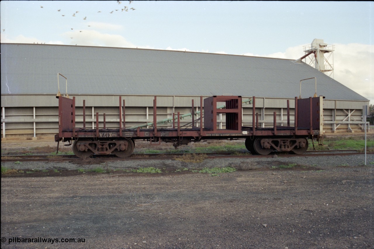 136-23
Deniliquin, broad gauge V/Line VZTX class bogie sleeper carrying waggon VZTX 13 side view opposite Victorian Oats Pool shed.
Keywords: VZTX-type;VZTX13;