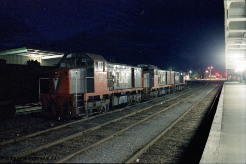 136-25
Shepparton station platform view looking north, night shot of three broad gauge V/Line T class locos, T 401 Clyde Engineering EMD model G18B serial 67-496, T 383 Clyde Engineering EMD model G8B serial 64-338 and sister T 382 serial 64-337.
Keywords: T-class;T401;Clyde-Engineering-Granville-NSW;EMD;G18B;67-496;