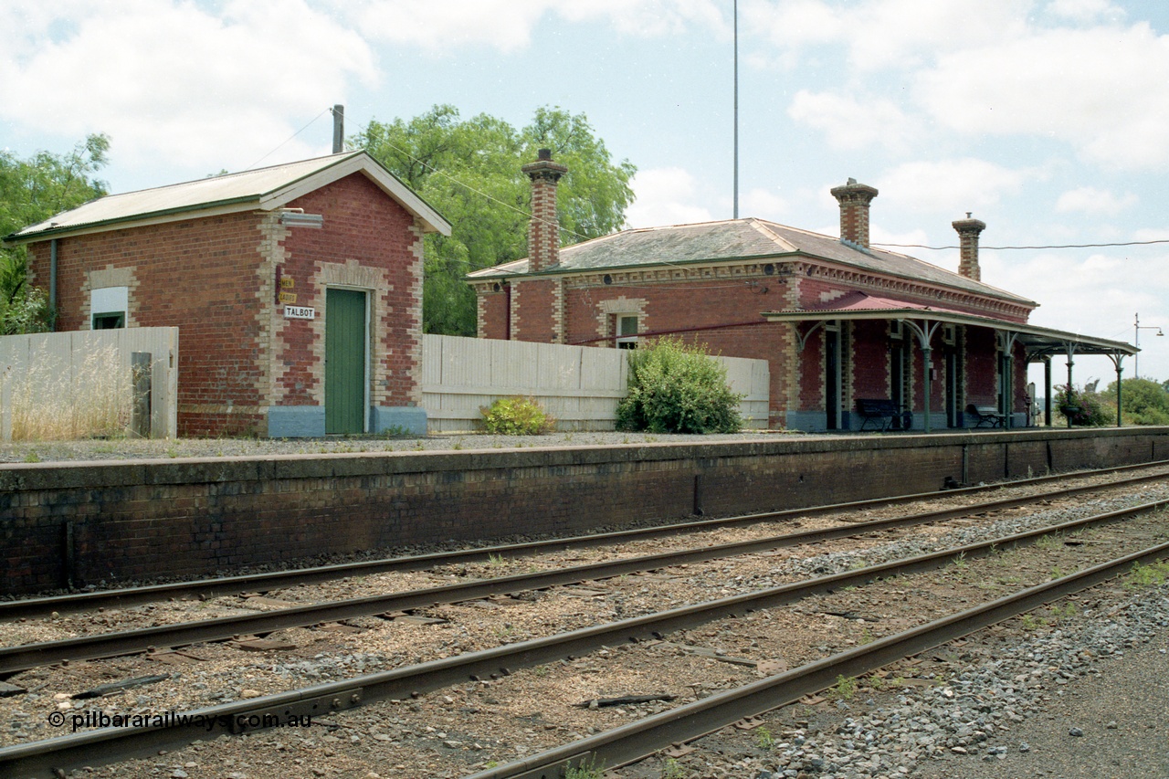 138-24
Talbot station overview, built around 1875, platform, brick lamp room and station building, track view, looking north.
