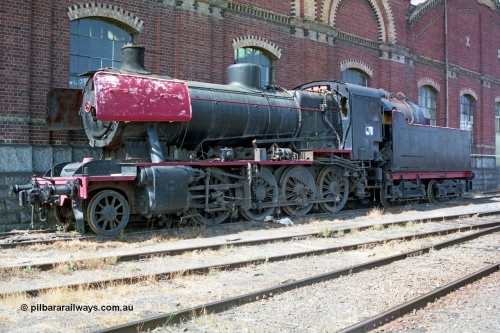 138-03
Bendigo Workshops building, Victorian Railways J class J 541 serial 6087 built by Vulcan Foundry, Newton-le-Willows in Lancashire, England in 1954, an oil burning Consolidation model 2-8-0 steam locomotive, stored.
