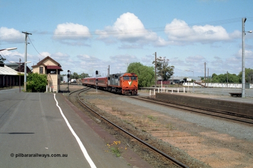 138-12
Bendigo station overview looking south past Bendigo A box, V/Line broad gauge N class N 458 'City of Maryborough' Clyde Engineering EMD model JT22HC-2 serial 85-1226 arriving with N set on a down passenger service.
Keywords: N-class;N458;Clyde-Engineering-Somerton-Victoria;EMD;JT22HC-2;85-1226;