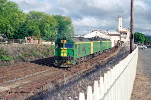 139-22
Ballarat station, Australian National broad gauge BL class BL 32 Clyde Engineering EMD model JT26C-2SS serial 83-1016 leading a down Adelaide bound goods train with a sister unit departing the station precinct, passing Lydiard Street Ballarat B signal box under the semaphore signal gantry.
Keywords: BL-class;BL32;Clyde-Engineering-Rosewater-SA;EMD;JT26C-2SS;83-1016;