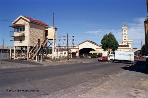 140-1-19
Ballarat, station and B Signal Box overview, view of the elevated box, semaphore signal gantry, interlocked gates on Lydiard Street, station building, canopy and clock tower, taken from Ararat St.
