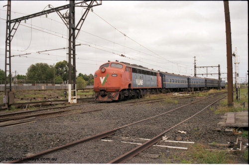 141-1-16
Sunshine, broad gauge V/Line B class B 61 Clyde Engineering EMD model ML2 serial ML2-2 leads the blue rake of South Australian K type carriages, AK 1 (500), BK 1 (702), BKL 3 (600) and BK 2 (703), on a down Bacchus Marsh passenger train heading into platform 3.
Keywords: B-class;B61;Clyde-Engineering-Granville-NSW;EMD;ML2;ML2-2;bulldog;