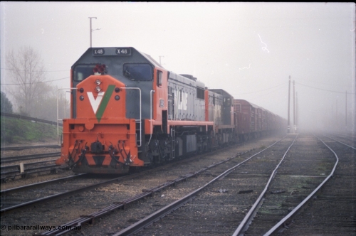 142-1-12
Benalla yard view, stabled broad gauge Wodonga goods train 9303 with V/Line X class X 48 Clyde Engineering EMD model G26C serial 75-795 and T class T 408 Clyde Engineering EMD model G18B serial 68-624.
Keywords: X-class;X48;Clyde-Engineering-Rosewater-SA;EMD;G26C;75-795;