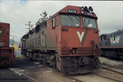142-2-12
Wodonga loco depot, turntable roads, V/Line broad gauge N class loco N 474 'City of Traralgon' Clyde Engineering EMD model JT22HC-2 serial 87-1203 rests between jobs at the turntable.
Keywords: N-class;N474;Clyde-Engineering-Somerton-Victoria;EMD;JT22HC-2;87-1203;