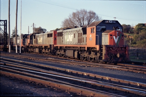 142-3-20
Albury south yard, V/Line broad gauge locos X classes, X 50 Clyde Engineering EMD model G26C serial 75-797 and X 44 serial 70-707 and T class T 369 Clyde Engineering EMD model G8B serial 64-324 are on the point of up Albury steel train 9334, awaiting departure time.
Keywords: X-class;X50;Clyde-Engineering-Rosewater-SA;EMD;G26C;75-797;