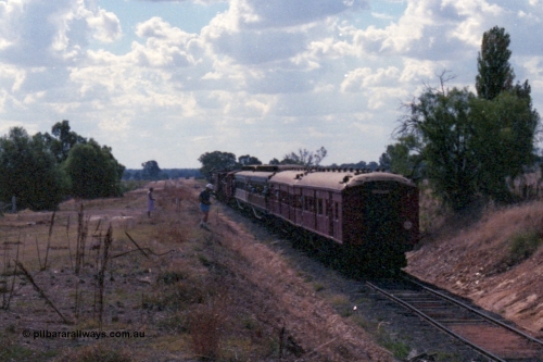 143-23
Rutherglen, down 'Stringybark Express' special climbs up grade towards Wahgunyah having just past under the High St over bridge.
