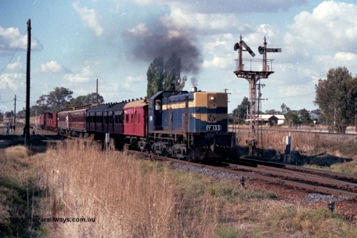 144-05
Springhurst, up 'Stringybark Express' Wahgunyah mixed special blasts out of No. 2 Rd bound for Wangaratta hauled by VR liveried broad gauge Y class Y 133 Clyde Engineering EMD model G6B serial 65-399 passing semaphore signal Post 3 with the right arm pulled off for No. 2 Rd to Main Line, the standard gauge line is elevated on the right.
Keywords: Y-class;Y133;Clyde-Engineering-Granville-NSW;EMD;G6B;65-399;