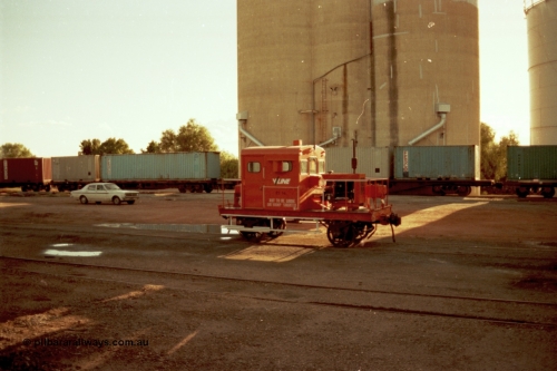 144-37
Boort yard view, silos with loading spouts, containers on waggons, Holden HK sedan and broad gauge V/Line RT class rail tractor RT 14. RT 14 was built new by Newport Workshops June 1959.
Keywords: RT-class;RT14;Victorian-Railways-Newport-WS;
