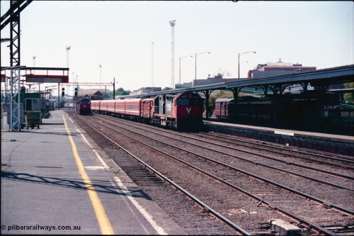 145-09
Spencer Street Station Platform 3 view of board gauge V/Line N class N 453 'City of Albury' Clyde Engineering EMD model JT22HC-2 serial 85-1221 arriving with a 5 car N set into Platform 2 as N class N 469 shunts down in the distance.
Keywords: N-class;N453;Clyde-Engineering-Somerton-Victoria;EMD;JT22HC-2;85-1221;