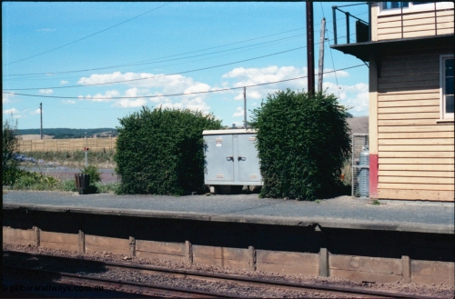 145-16
Wallan, up or No.2 platform, showing electrical cabinet, hedge, platform coping and bin.
