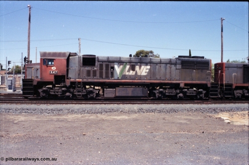 146-07
Seymour, rationalised broad gauge yard view with stabled Wodonga goods 9303 behind V/Line X class X 47 Clyde Engineering EMD model G26C serial 75-794, side view.
Keywords: X-class;X47;Clyde-Engineering-Rosewater-SA;EMD;G26C;75-794;