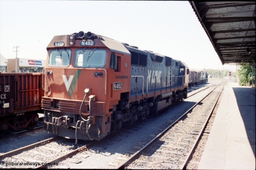 146-13
Seymour station platform view, looking north, broad gauge V/Line N class N 462 'City of Shepparton' Clyde Engineering EMD model JT22HC-2 serial 86-1191 stabled in No.2 Rd awaiting the Sunday evening combined Albury - Cobram pass 8343 so it can run the Cobram pass 8345, behind it is stabled 9303 down Wodonga goods in the rationalised yard.
Keywords: N-class;N462;Clyde-Engineering-Somerton-Victoria;EMD;JT26HC-2;86-1191;